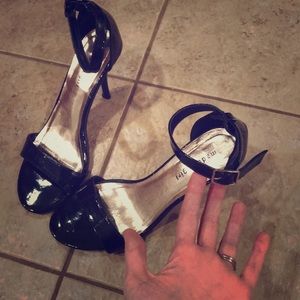 Black patent leather Madden Girl heels.
